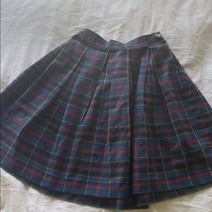 Blue plaid skirt.
